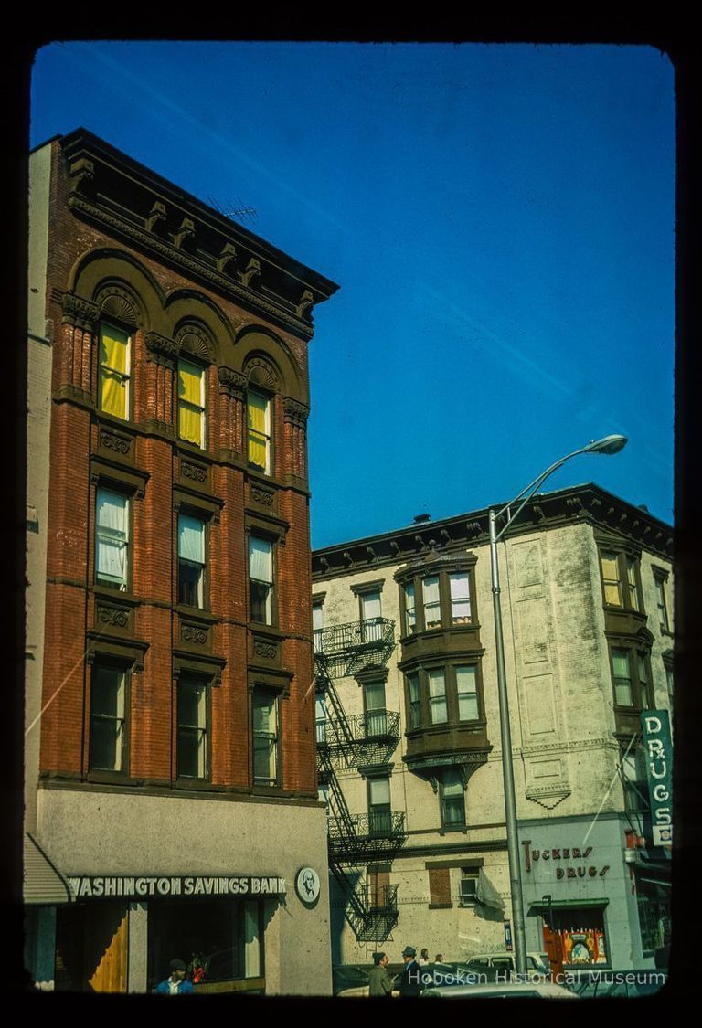 Color slide of eye-level view of 938 and 1000 Washington at the intersection of Washington & 10th looking NW showing Washington Savings Bank and Tucker's Drugs picture number 1