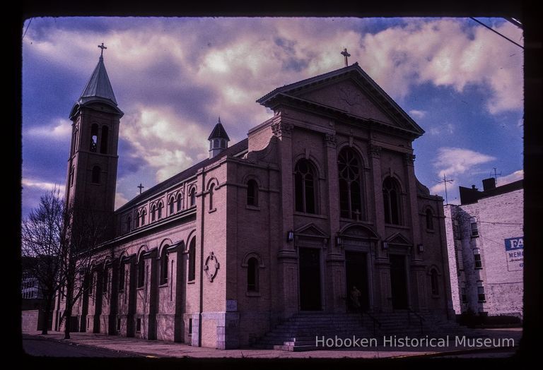 Color slide of eye-level view of front and side façades and bell tower of St. Ann's Roman Catholic church at 704 Jefferson on the NW corner of Jefferson & 7th picture number 1