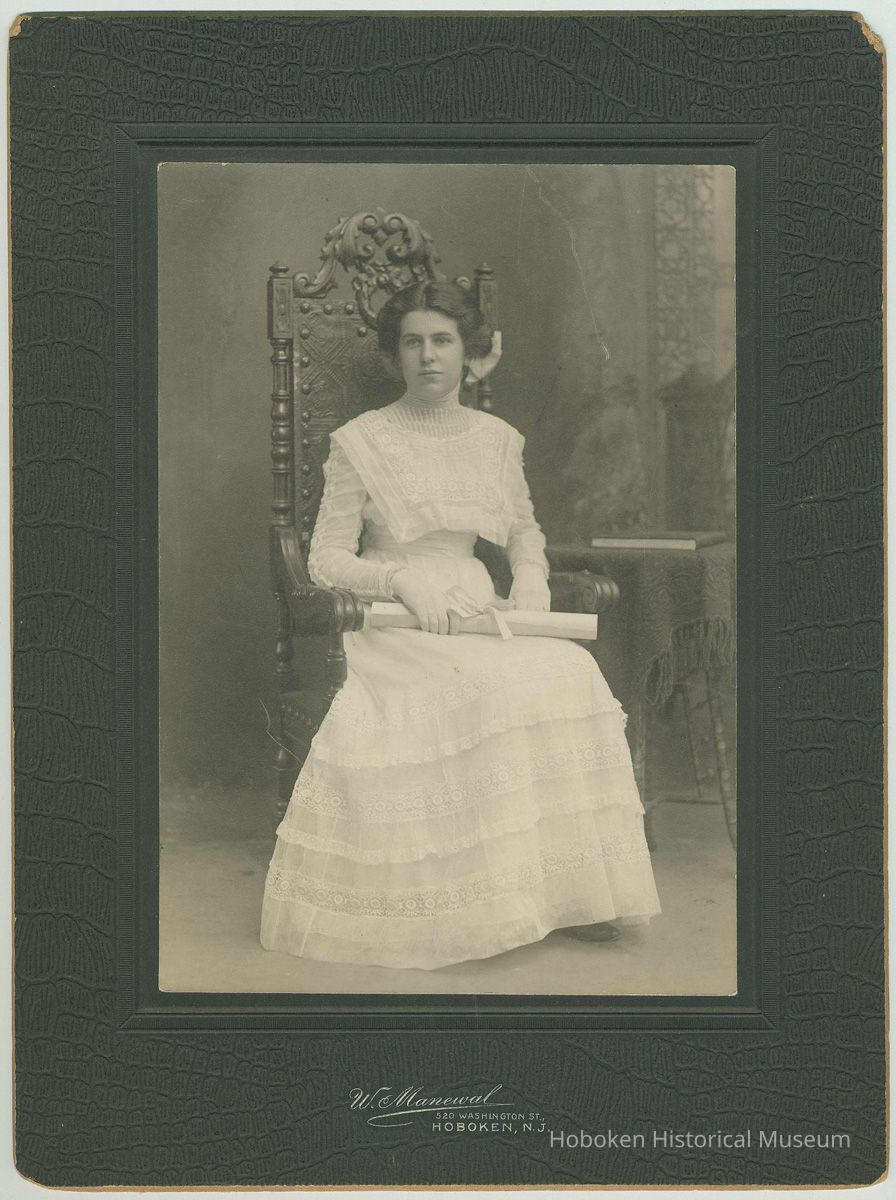 Photo of Florence or Madeline Miller, ca. 18 years old, seated in a chair at the photographer's studio, Hoboken, no date, ca. 1905-1910. picture number 1