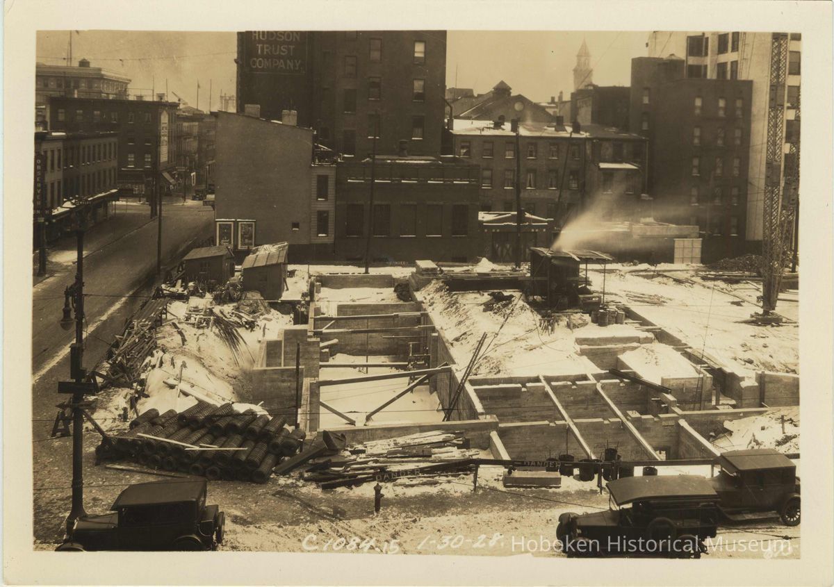 Sepia-tone photo of progress in foundation construction on the north end of the site for the Fabian Theatre, Hoboken, Jan 30, 1928. picture number 1