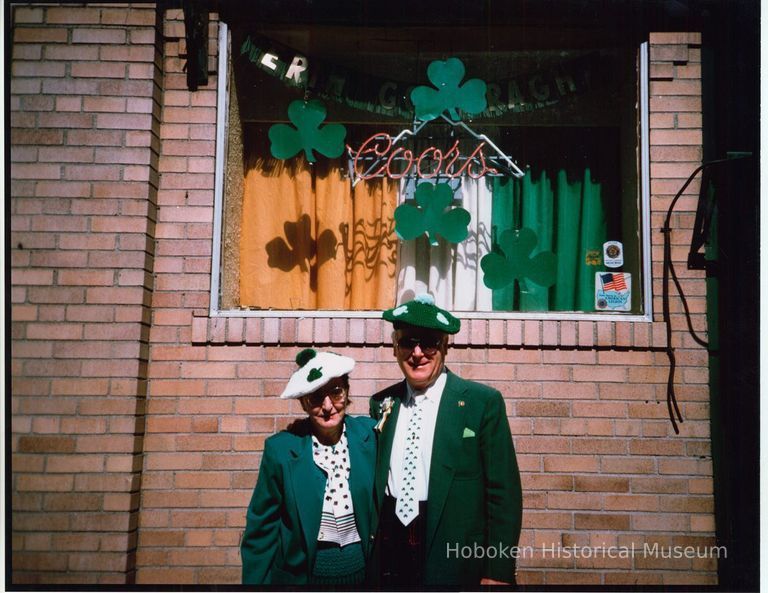 Color photo of woman and man in Irish dress posed outside Shannon Lounge, First St., Hoboken, n.d, ca. 1980-1985. picture number 1