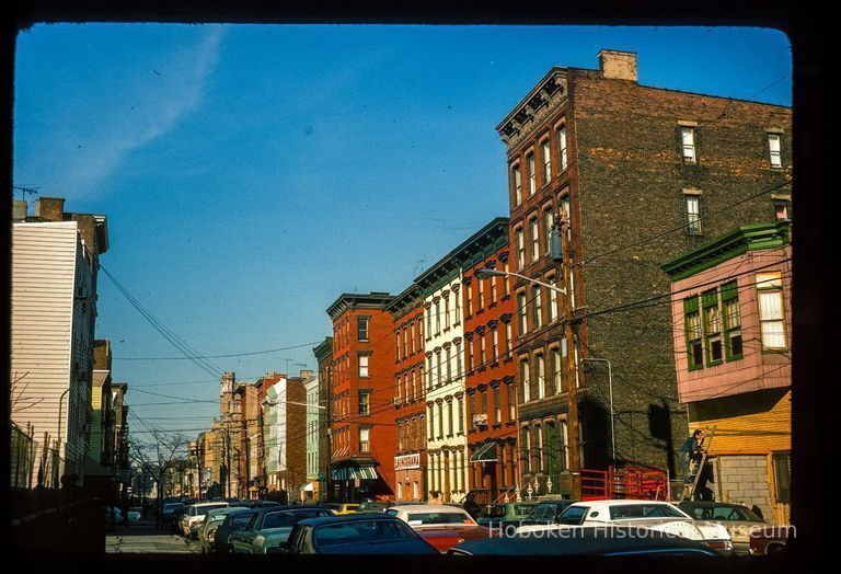 Color slide of eye-level view of row houses on the E side of Adams between 4th and 5th looking N picture number 1