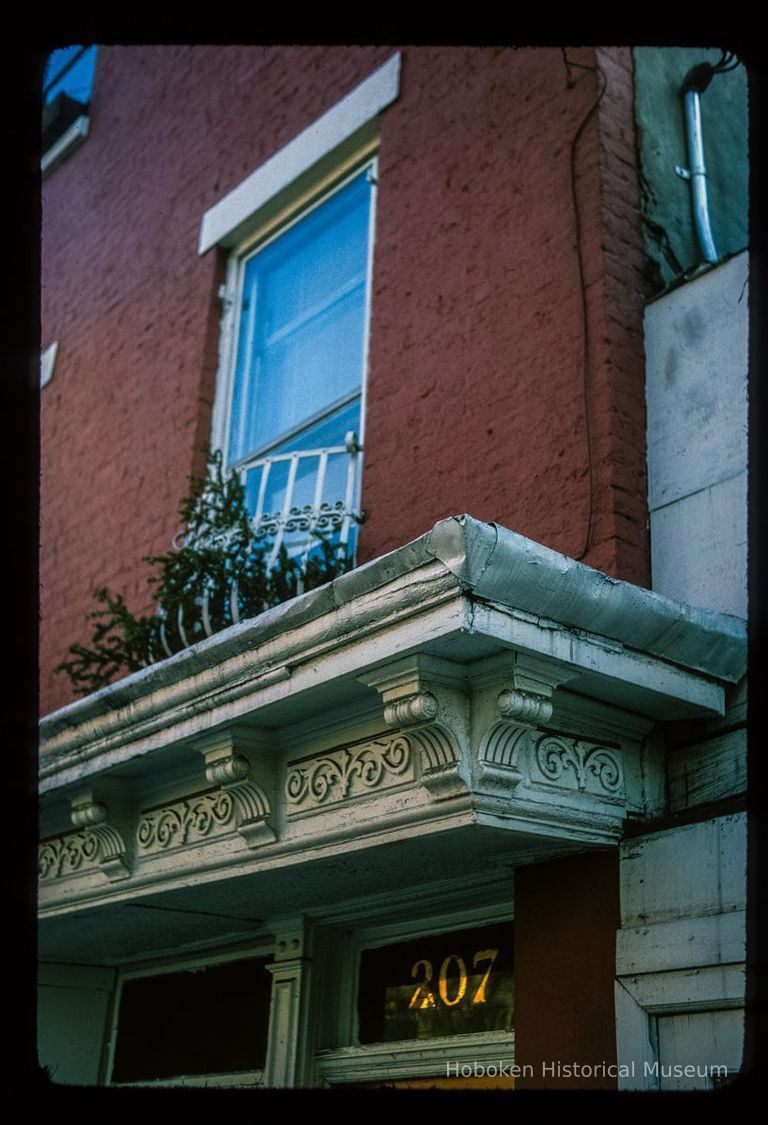 Color slide of detail view of cornice, frieze, and transom window at 207 4th between Garden and Park picture number 1