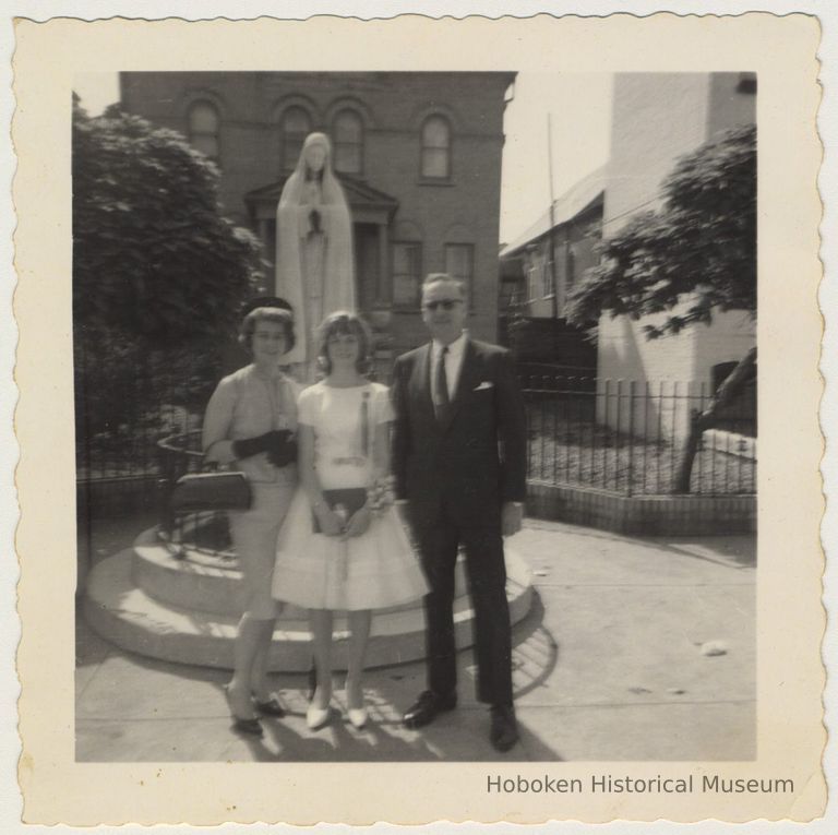 photo 1: Thomas & Elsie Kelly with daughter Irene, outside St. Ann's, 1962