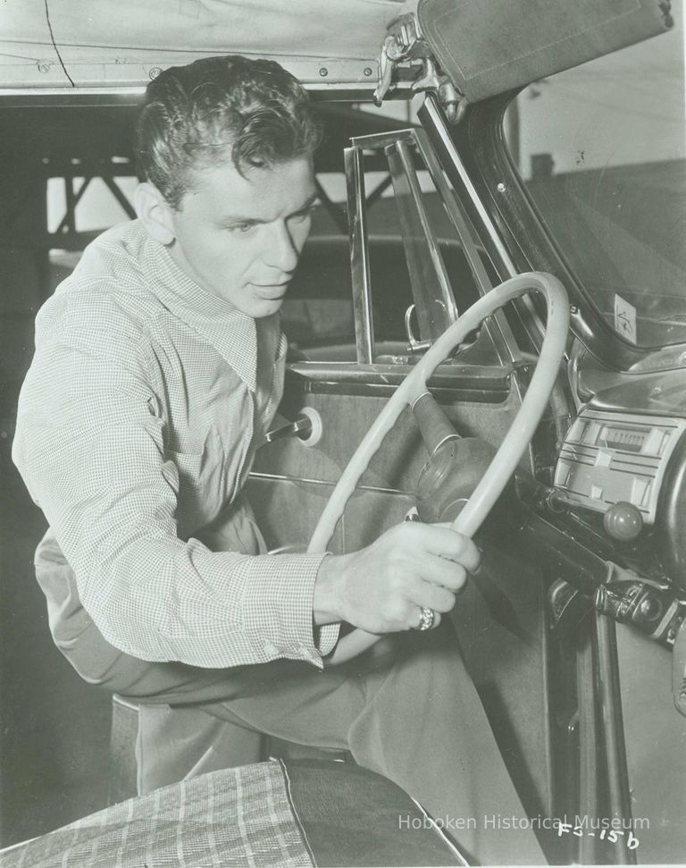 B+W reproduction photo of Frank Sinatra getting into a car, no place, no date, ca. 1950. picture number 1