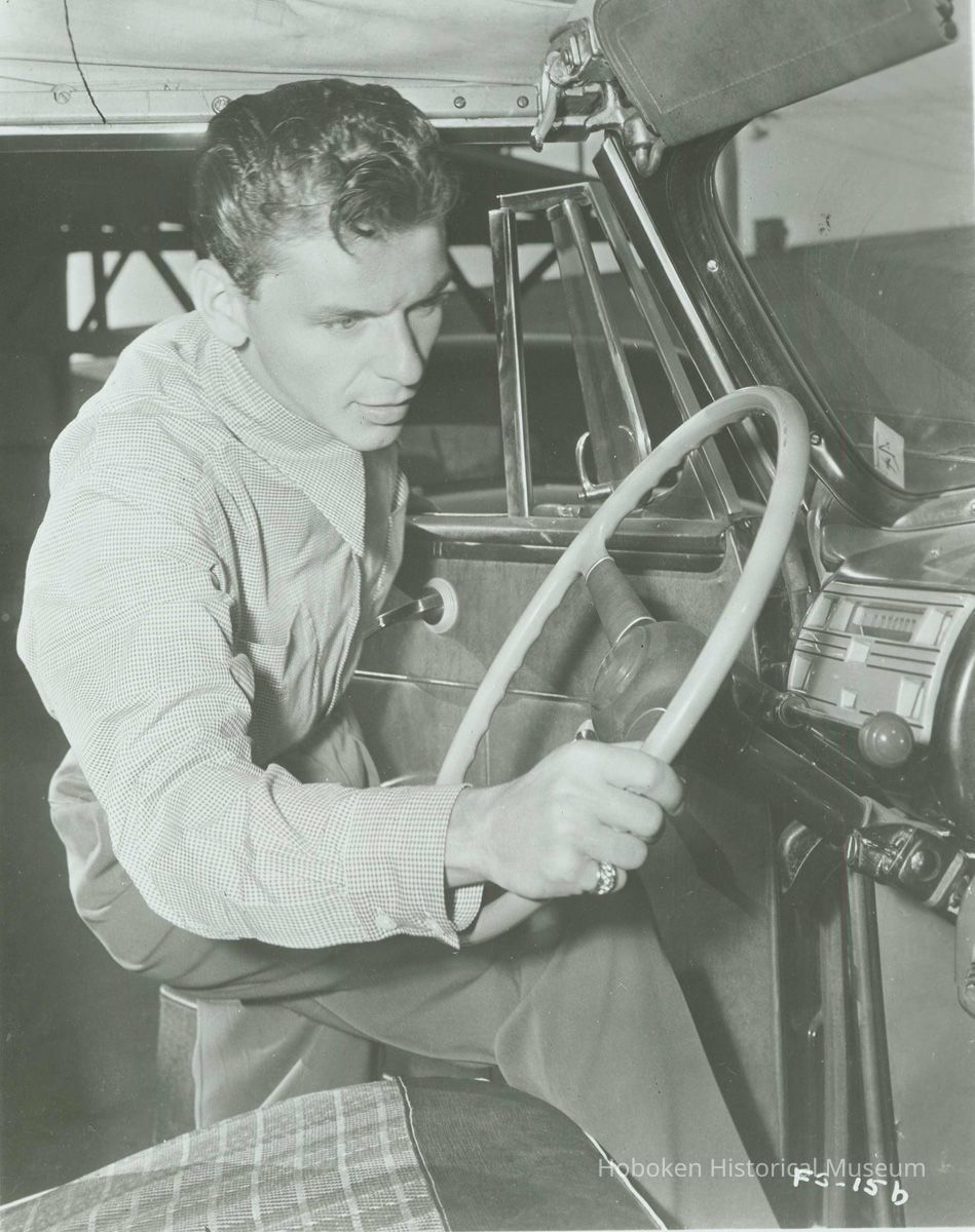 B+W reproduction photo of Frank Sinatra getting into a car, no place, no date, ca. 1950. picture number 1