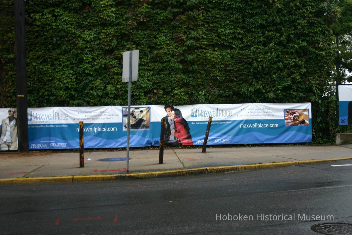 Digital color image of the Maxwell House Coffee plant site with printed vinyl fence sign banners, Hoboken, October 2004. picture number 1