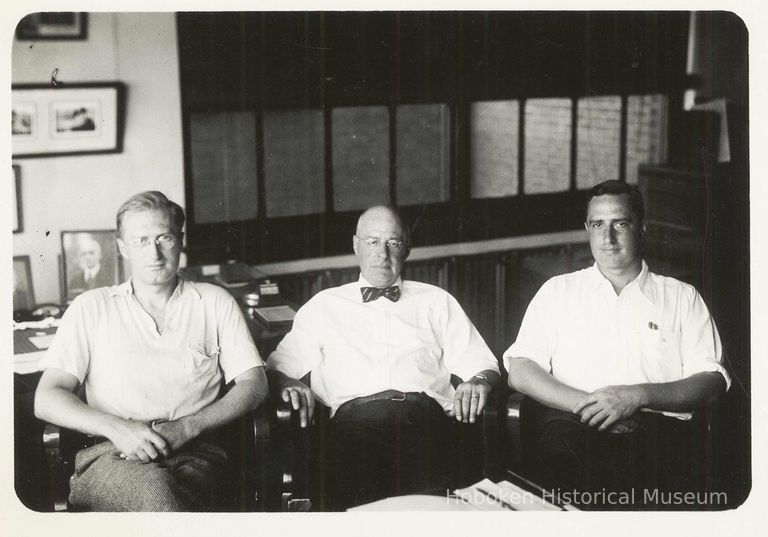 B+W photo of R. Neumann & Co., three men in an office, Hoboken, no date, ca. 1950-60. picture number 1