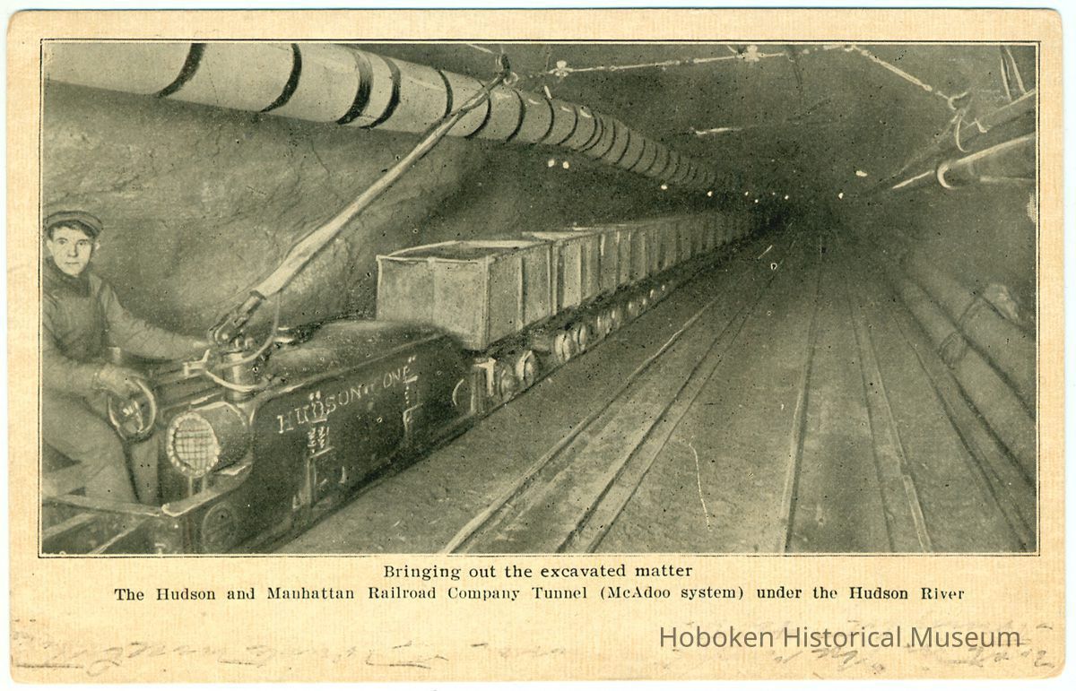 Digital image of postcard titled: Bringing out the excavated matter, The Hudson & Manhattan Railroad Co. Tunnel (McAdoo system), 1908. picture number 1