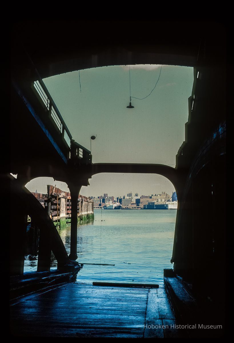 Color slide of eye-level view of the Hudson River and New York City looking E from inside the Lackawanna Terminal picture number 1