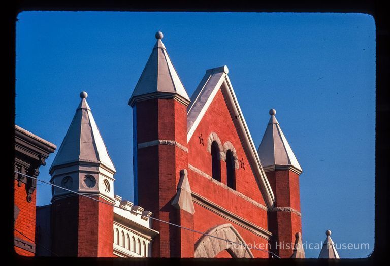 Color slide of detail view of roofline turrets and pediment at 827 Bloomfield between 8th & 9th picture number 1