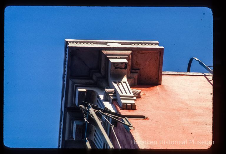 Color slide of detail view of cornice, brackets and fire escape at 155 6th between Bloomfield and Garden picture number 1