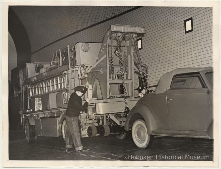 B+W photo of emergency tow truck demonstration in Lincoln Tunnel, Dec. 18, 1937. picture number 1