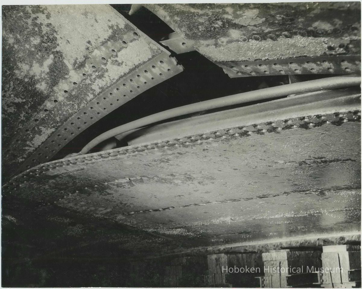 B+W photo of exterior view of damaged hull plates near keel on unidentified vessel at the Bethlehem Steel Shipyard, Hoboken Division, no date, ca. 19 picture number 1