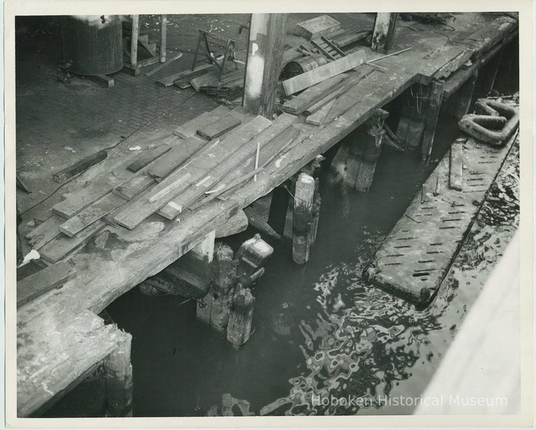 B+W photo documenting pier damage at the Bethlehem Steel Shipyard, Hoboken Division, no date (pre-1957) picture number 1