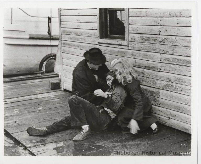 B+W publicity photo of Marlon Brando as Terry Malloy with Karl Malden, Eva Marie Saint in film 