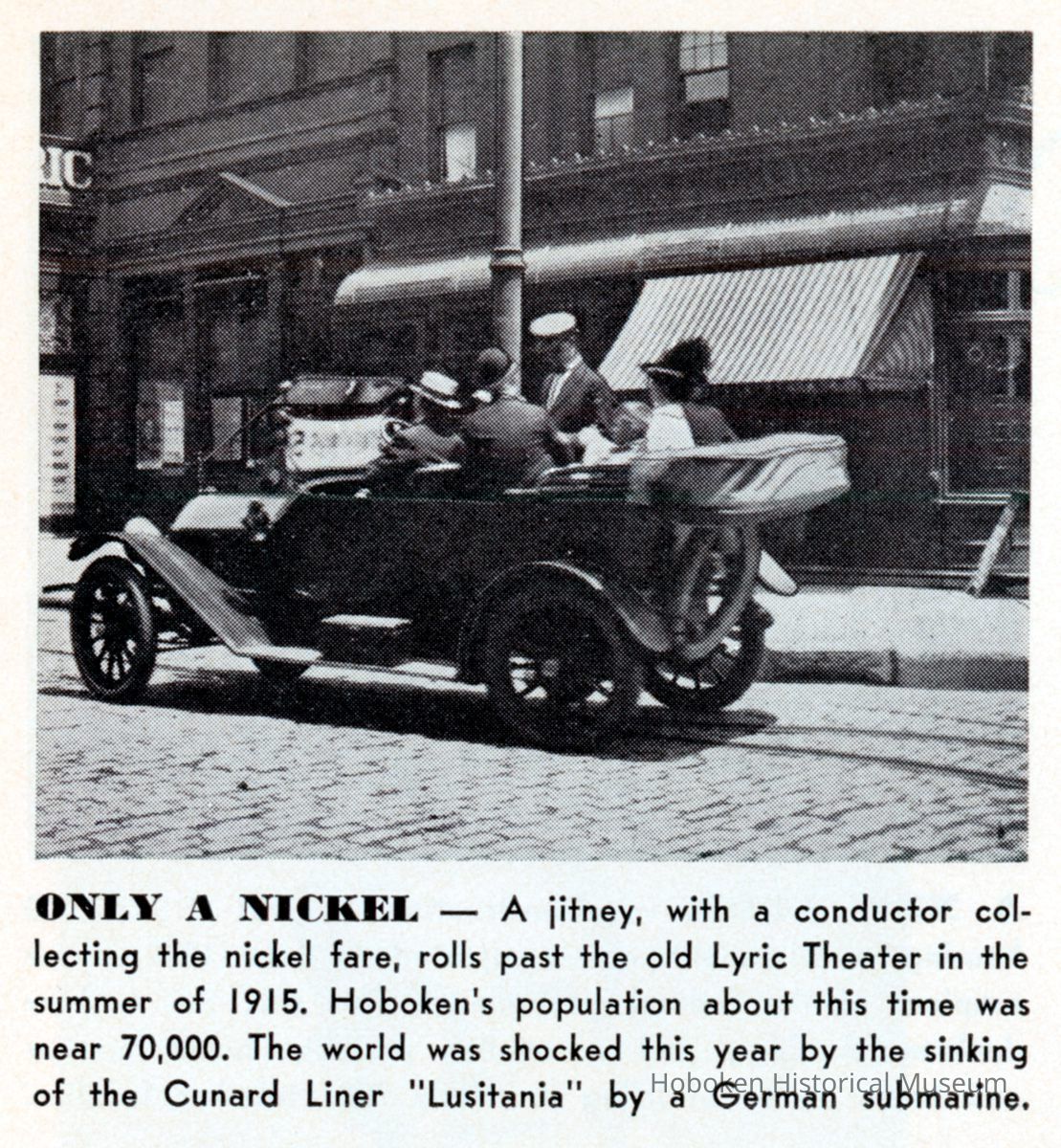 Reference image: A jitney (autobus) with conductor on Hudson St. near the former Lyric Theater, Hoboken, Summer, 1915. picture number 1