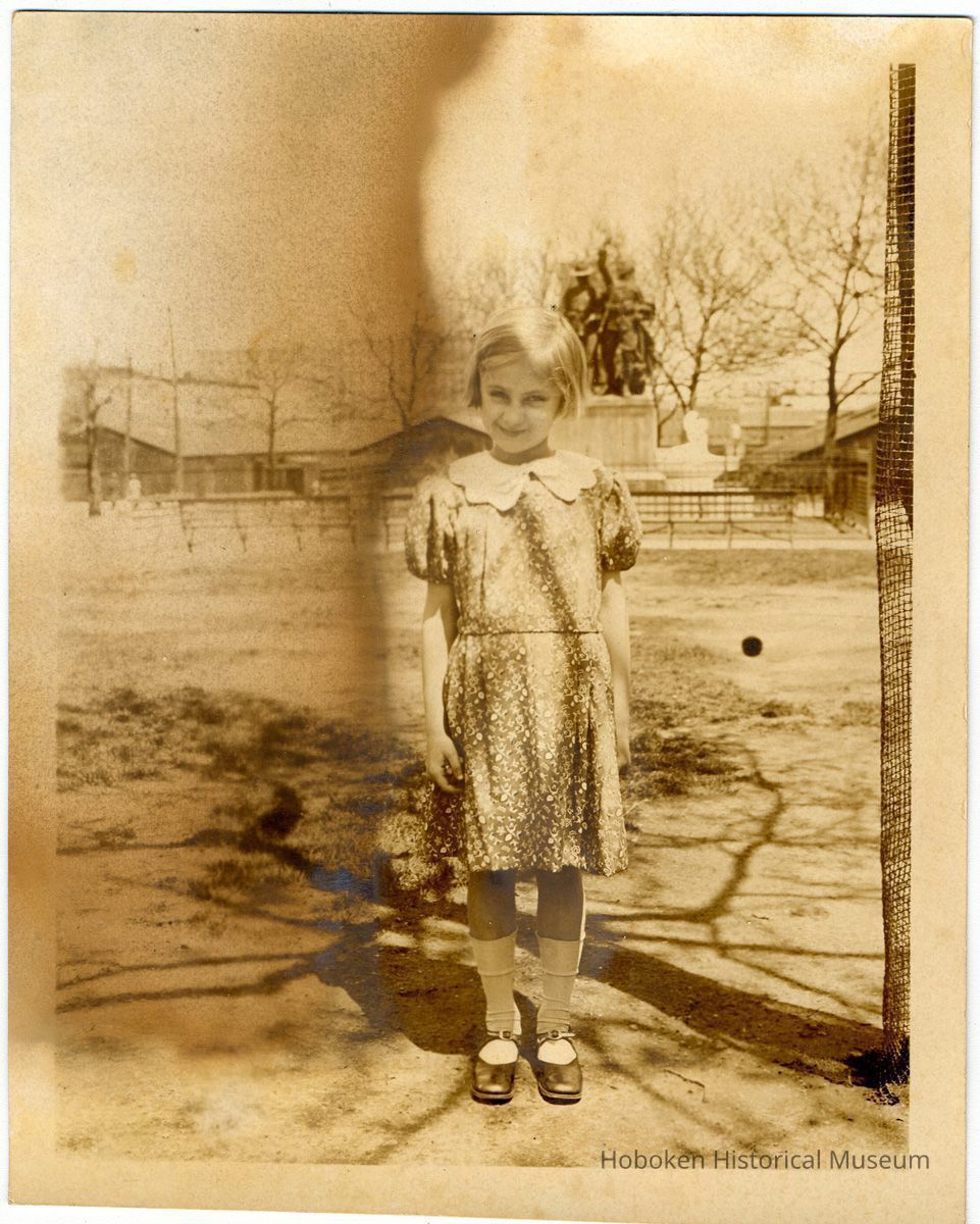 Sepia-toned photo of a young girl taken in Elysian Park, Hoboken, no date, ca. 1924-1926. picture number 1