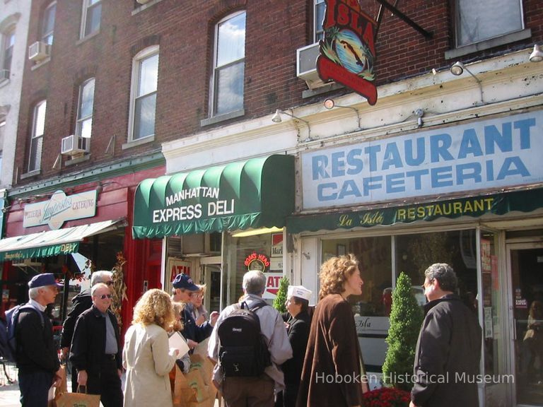 Digital copy of color photo of food tour members outside La Isla Restaurant, 104 Washington St., Hoboken, Oct. 18, 2003. picture number 1