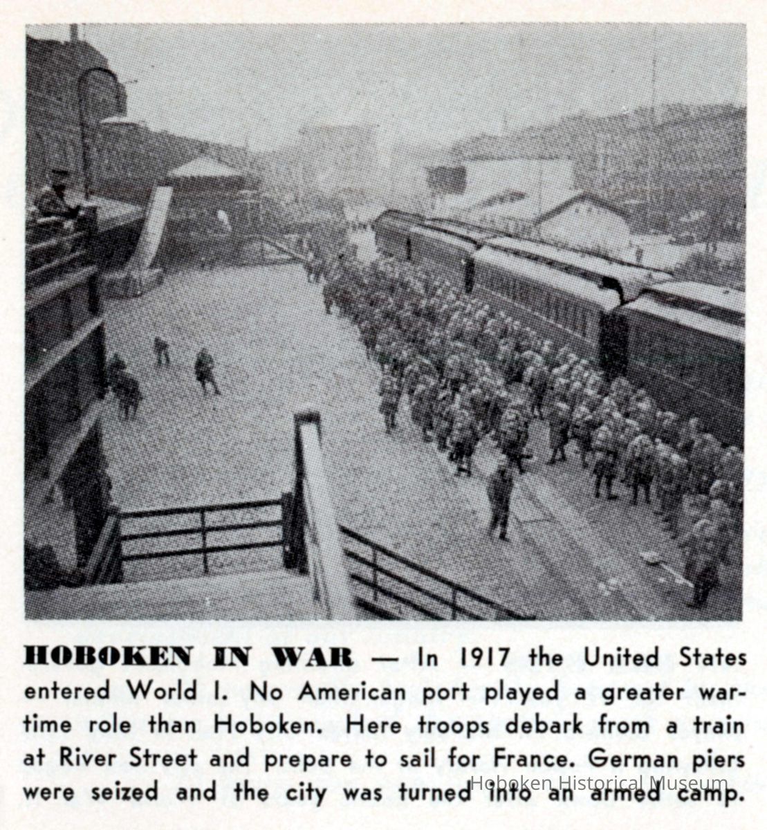 Reference image: Army troops debarking from a train on River St. at the Port of Embarkation, Hoboken, ca. 1917. picture number 1
