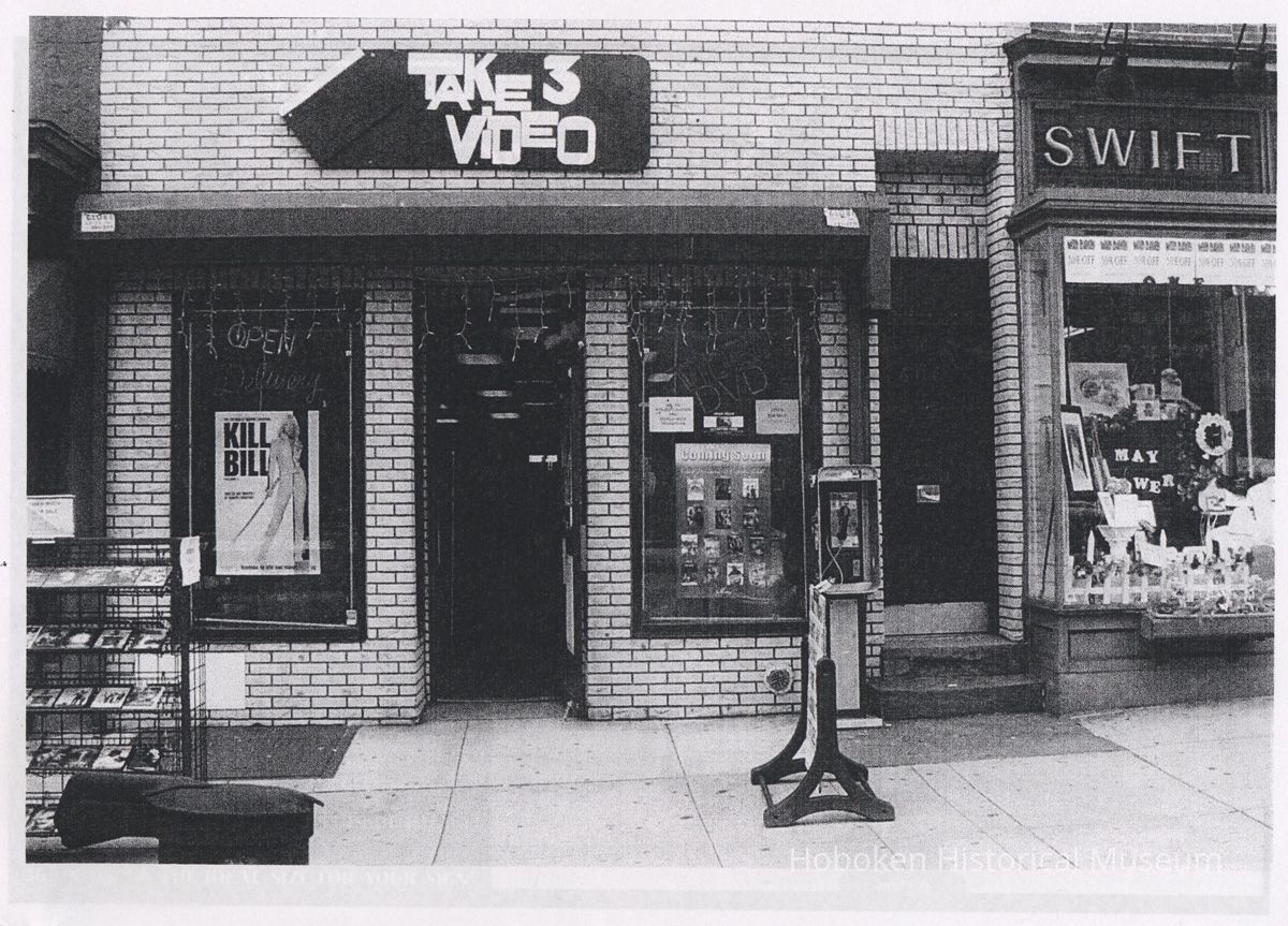 photo of facade with Take 3 Video signage