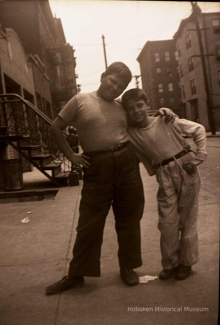 Black-and-white negative of two boys posed in front of an apartment building, Hoboken, no date, ca. 1930-40. picture number 1