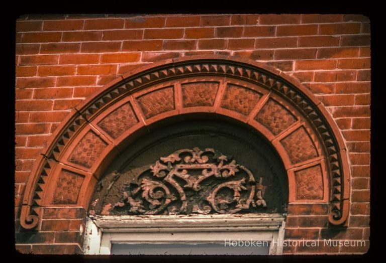 Color slide of close up-view of semicircular arch voussoirs on one of the buildings between 206 and 218 13th on the N side between Park and Garden picture number 1