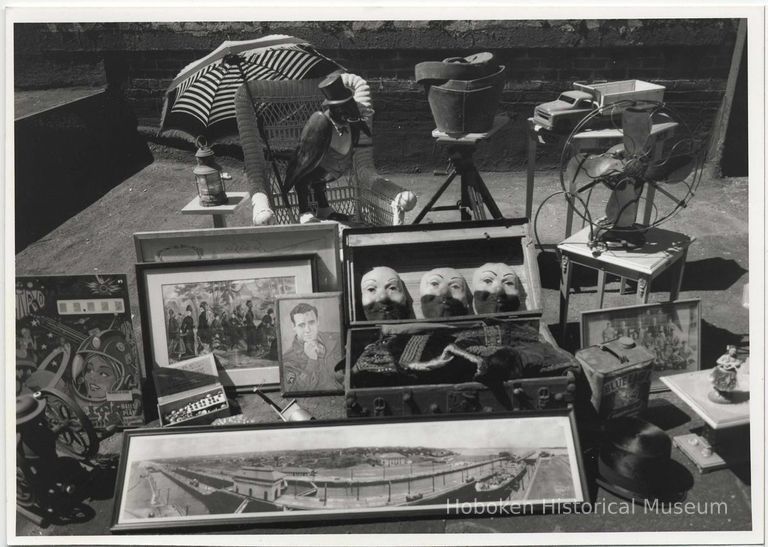 B+W photo of antique items laid-out for sale at a flea market in Neuman Leather building parking lot, Hoboken, no date, ca. 1994-95. picture number 1