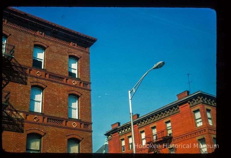 Color slide of close-up view of cornices, friezes, window heads and fire escapes on unidentified buildings at 12th and Washington picture number 1