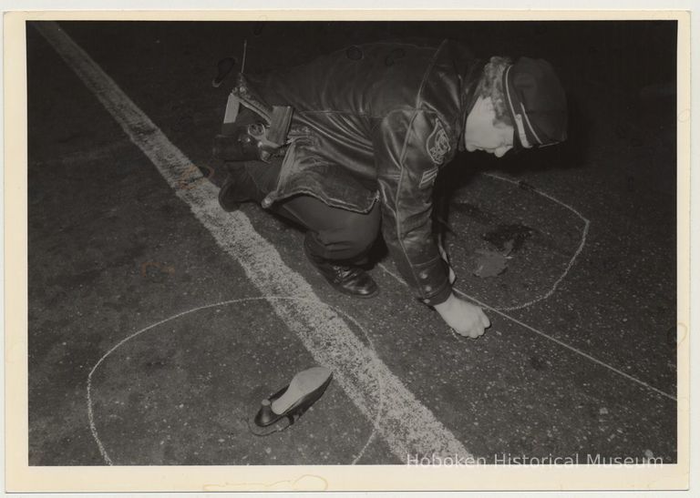 Police Officer John Aiello marking crime scene