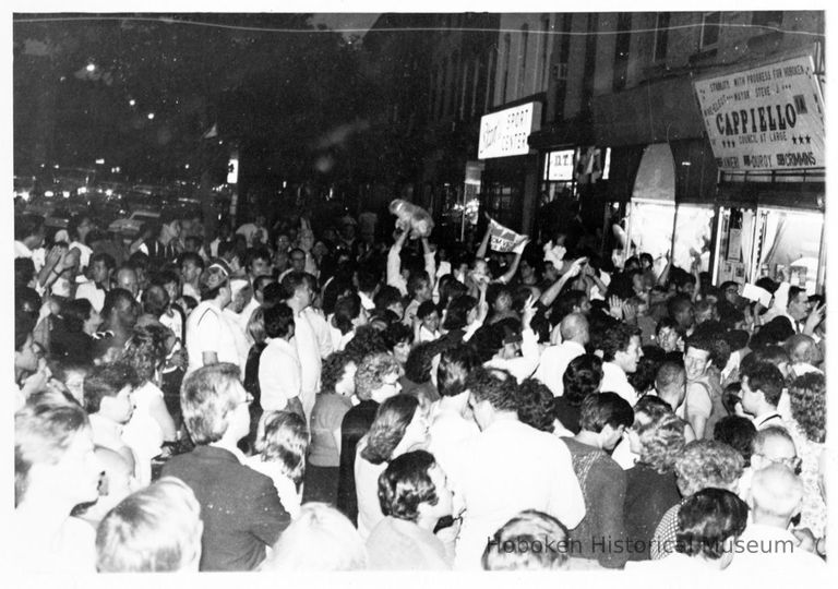 B+W photo of Tom Vezzetti supporters outside his campaign headquarters, 536 Washington St., on election night, Hoboken, [June 11, 1985]. picture number 1