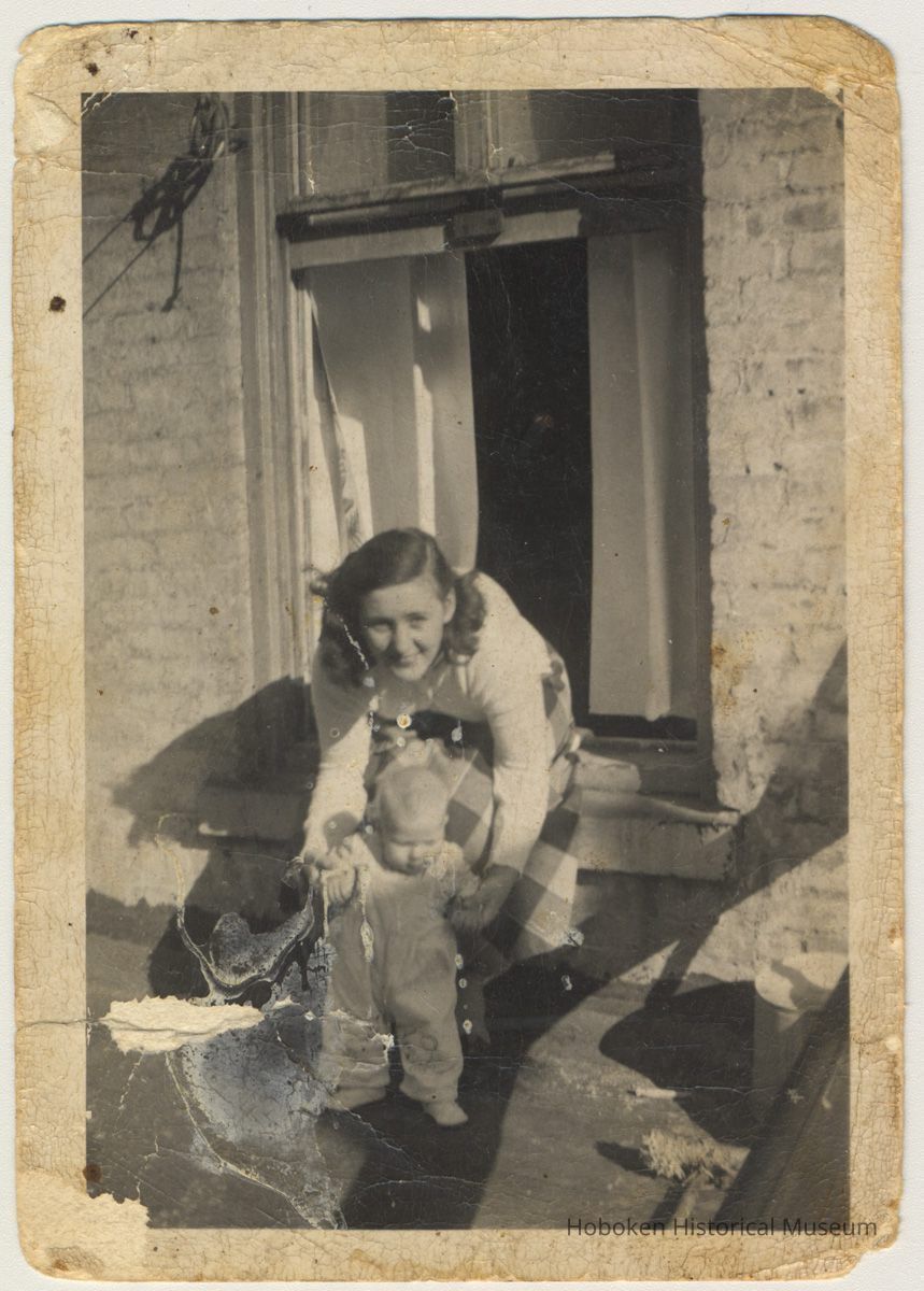 photo 1: Polly Peskens with child, Phyllis Peskens, River St. rooftop, 1952