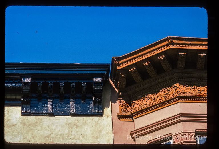 Color slide of detail view of cornice, brackets and frieze at 700 and 702 Hudson on the NW corner with 7th picture number 1