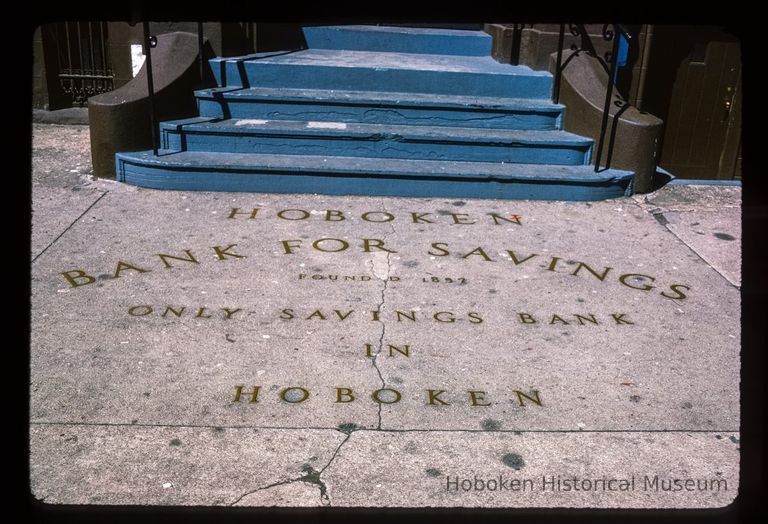 Color slide of close-up view of signage embedded in the sidewalk by the stoop at 84 Washington on the corner of Washington and Newark picture number 1