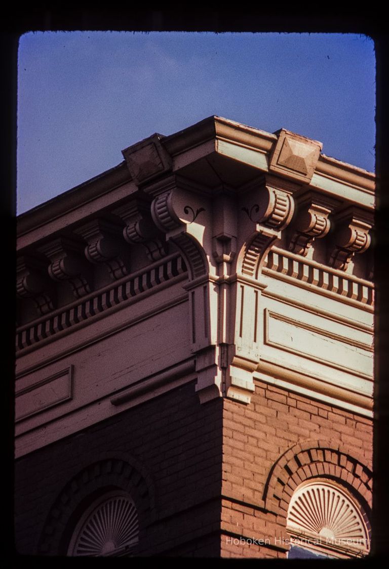 Color slide of detail view of cornice, brackets, dentils, frieze and brick semicircular arches at 209 14th Street on the SE corner with Park picture number 1