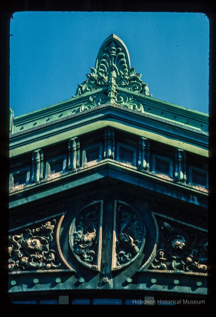 Color slide of detail view of the Lackawanna Terminal façade roofline showing finial, pediment and cornice picture number 1