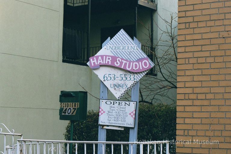 Color photo of painted sign for Underground Hair Studio, 407 Adams St., Hoboken, Jan. 3 & 4, 2002. picture number 1