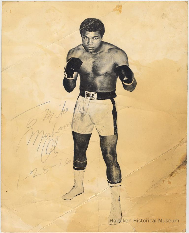 B+W photo of Muhammed Ali in boxing pose; inscribed to Mike [Yaccarino] (of Hoboken), no place, Jan. 28, 1976. picture number 1