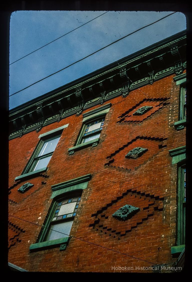 Color slide of detail view of façade, decorative tiles, stained glass windows and cornice at 1201 Garden on the NW corner of 12th picture number 1