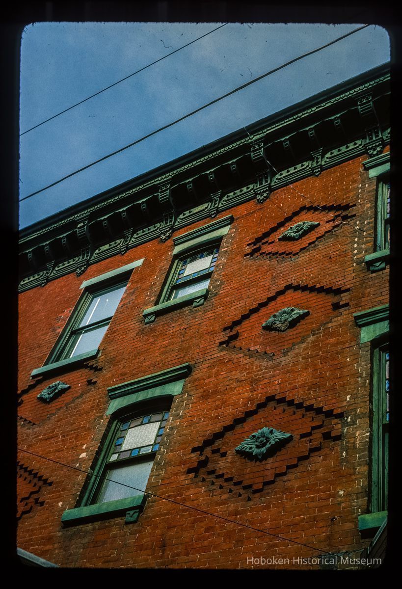 Color slide of detail view of façade, decorative tiles, stained glass windows and cornice at 1201 Garden on the NW corner of 12th picture number 1
