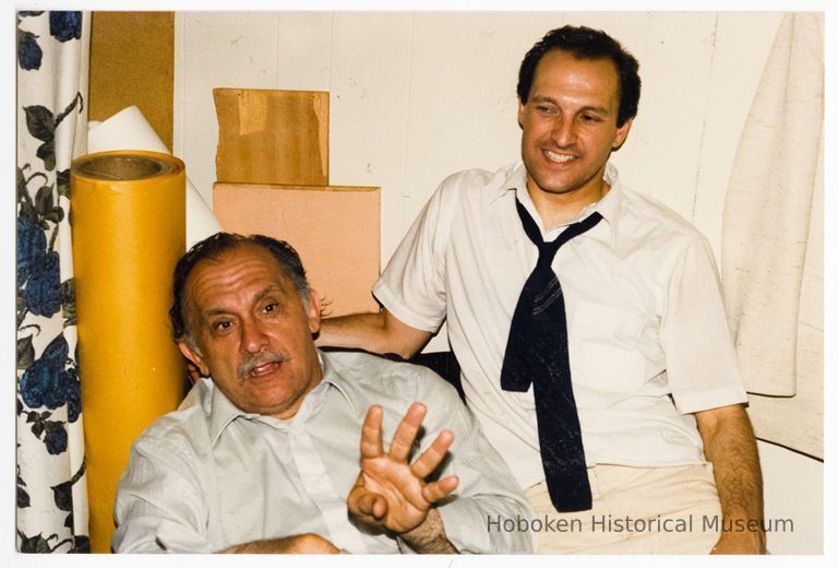 Color photo of mayoral candidate Tom Vezzetti with supporter possibly inside his campaign headquarters on election night, Hoboken, [June 11, 1985]. picture number 1