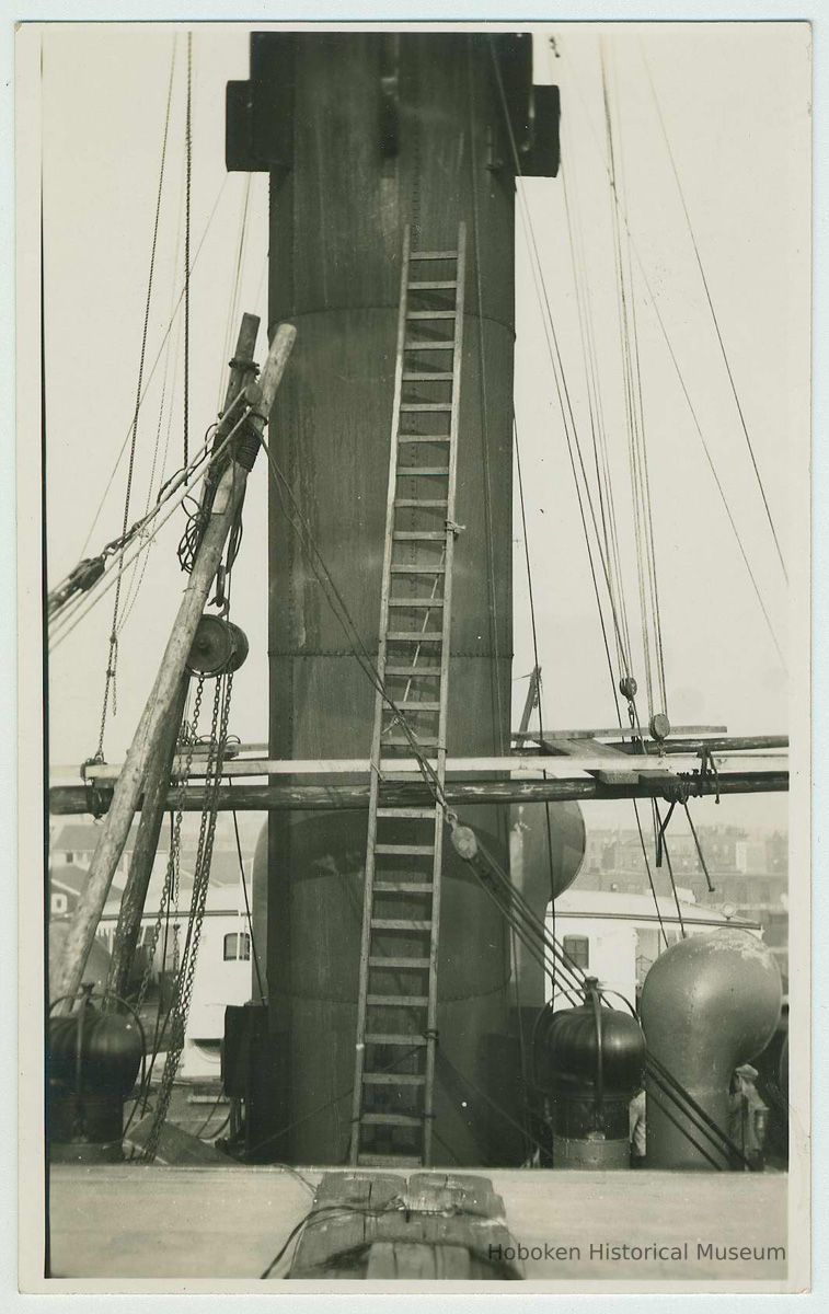 B+W photo print as postcard view of a funnel with wood work ladder leaning against it, no date, ca. 1940. picture number 1