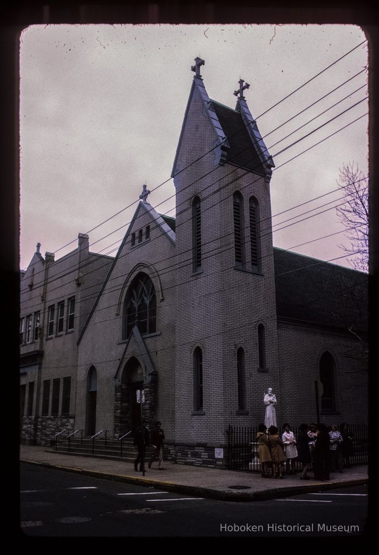 Color slide of eye-level view of front and side facades of St. Francis Roman Catholic Church at 308 Jefferson on the corner of Jefferson and 3rd picture number 1