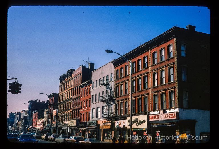 Color slide of eye-level view from the NE corner of Washington & 4th looking S at storefronts showing the Bargain Angels store picture number 1