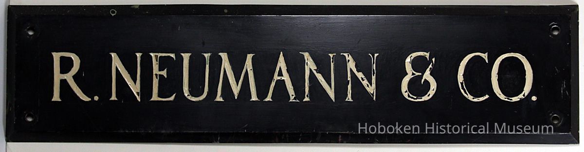 Metal wall sign: R. Neumann & Co. 9