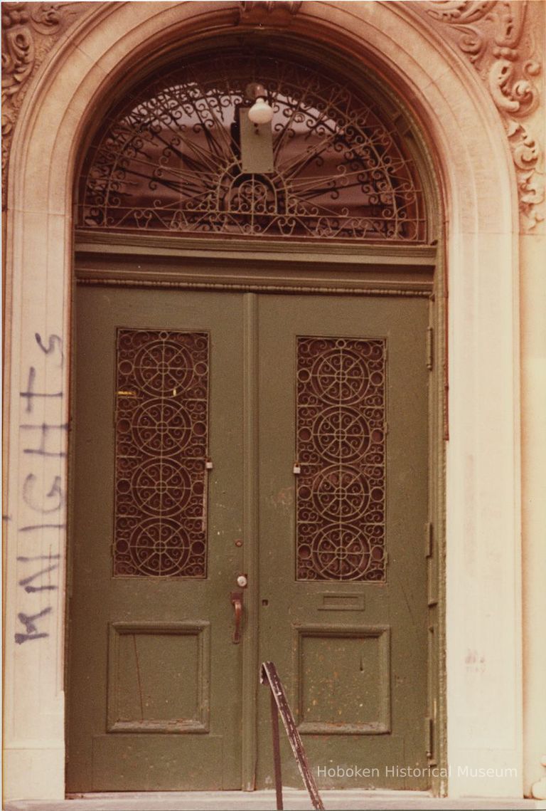 1: main entry doors, School for Industrial Education; graffiti