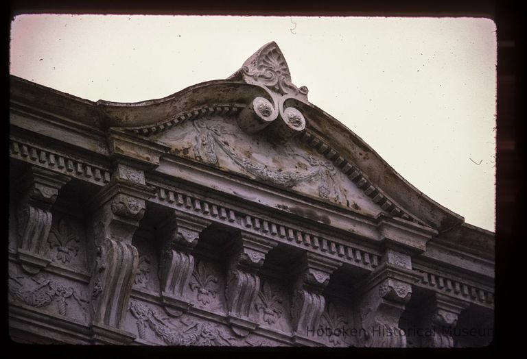 Color slide of close-up view of pediment, cornice, dentils and brackets at 702 Willow on the NW corner with 7th picture number 1