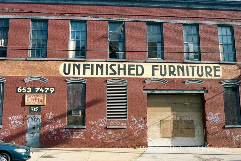 Color photo of a painted wall sign, Unfinished Furniture, at 715 Grand St., Hoboken, Jan. 3 & 4, 2002. picture number 1