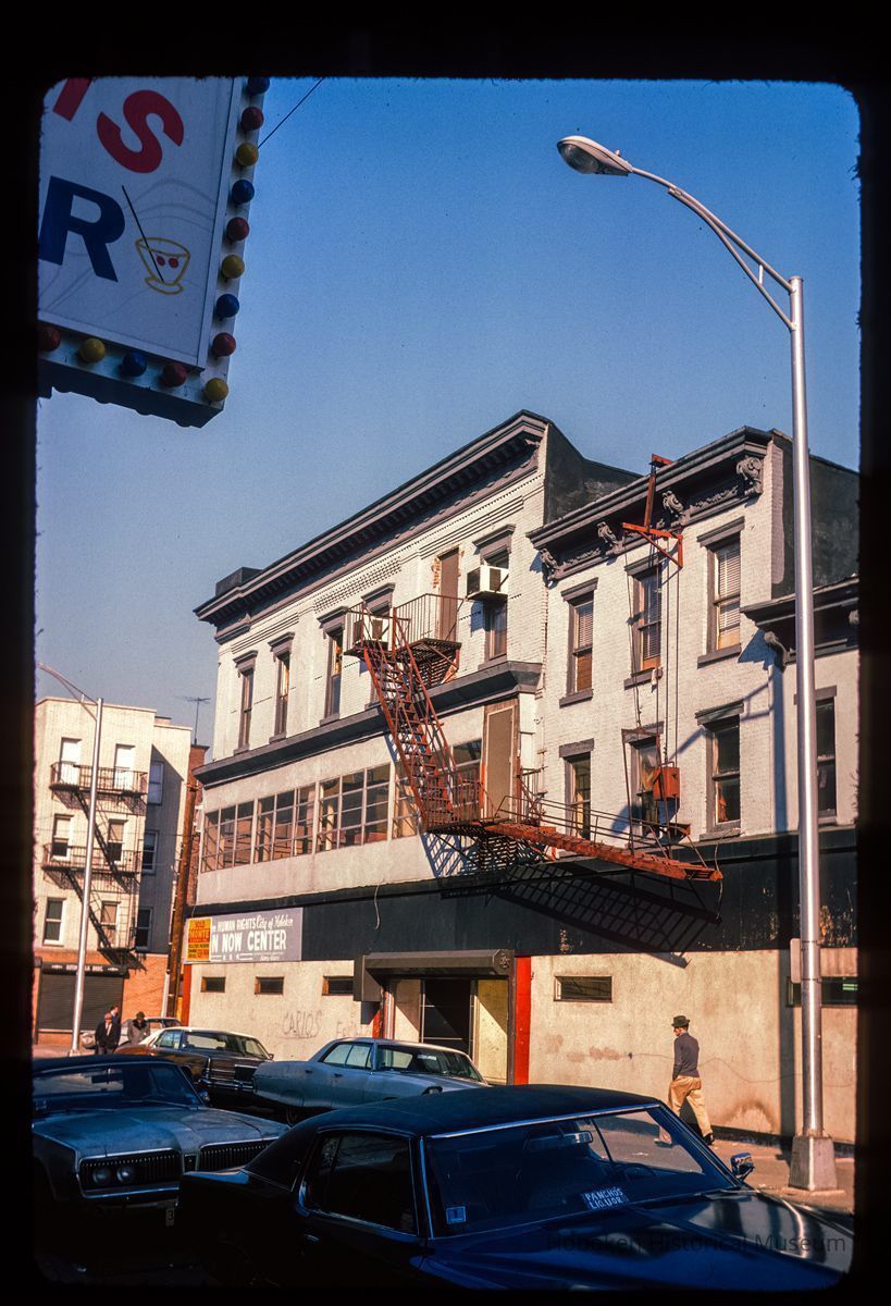 Color slide of eye-level view of unidentified building façades with fire escape on 1st between Bloomfield and Garden picture number 1