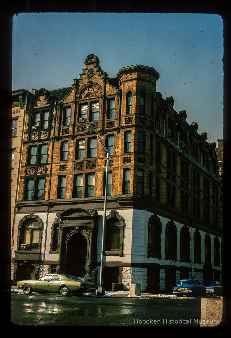 Color slide of eye-level view of front and side facades of the former Hoboken Bank for Savings building at 84 Washington on the SW corner of Washington & Newark picture number 1